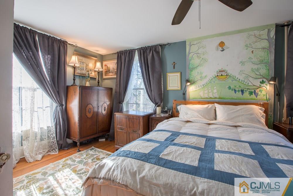 60 Rector Street Metuchen, NJ 08840 - Photo 11 of 25 a bed sitting in a bedroom next to a window