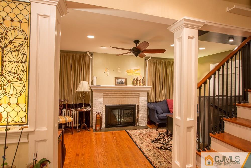 60 Rector Street Metuchen, NJ 08840 - Photo 23 of 25 a living room with furniture and a fireplace