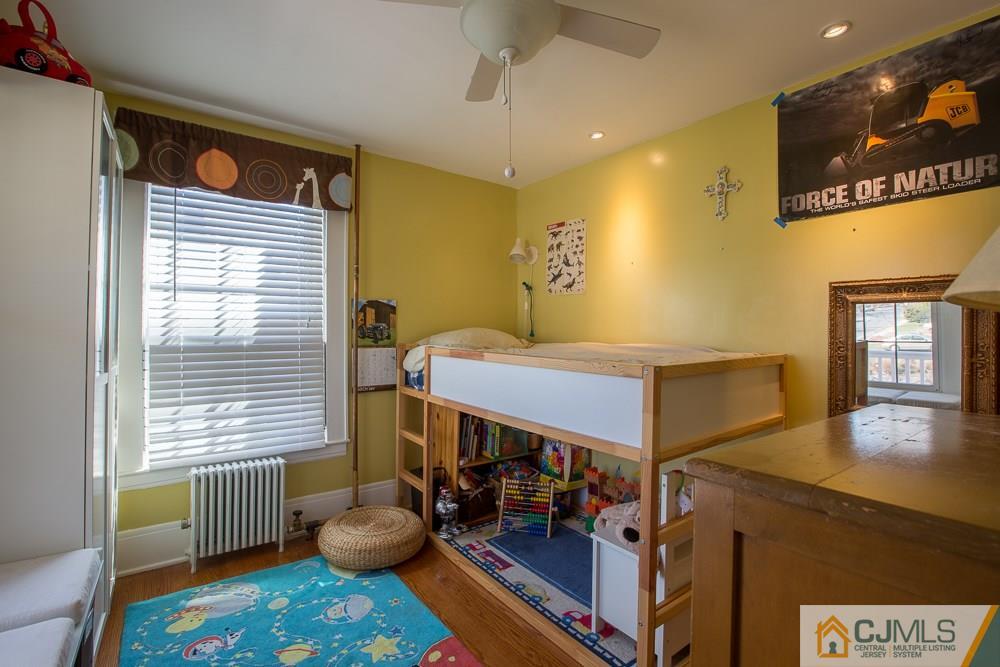 60 Rector Street Metuchen, NJ 08840 - Photo 8 of 25 a bedroom with a bed and a window