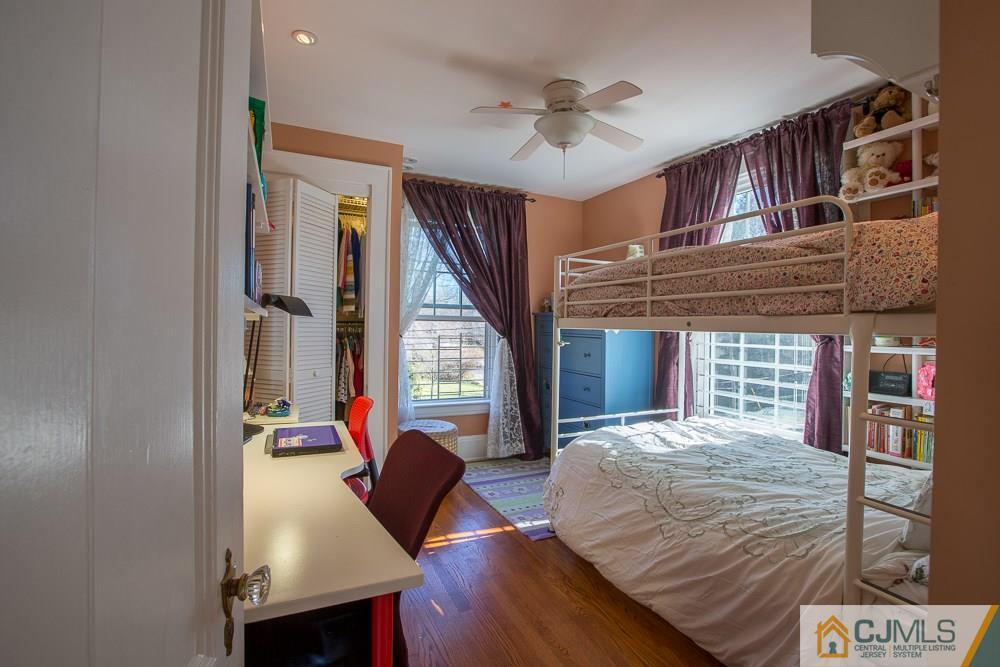 60 Rector Street Metuchen, NJ 08840 - Photo 9 of 25 a bedroom with a bed next to a window with outer view