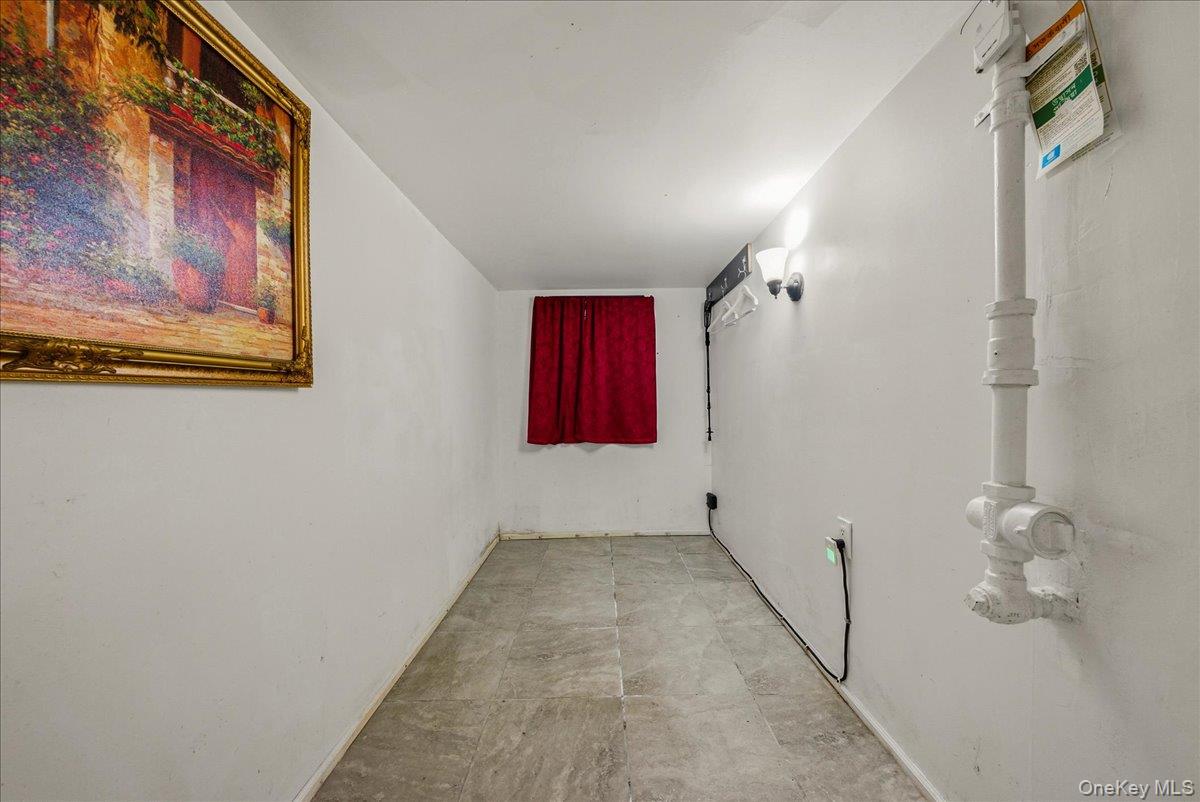 2304 Glebe Avenue Bronx, NY 10462 - Photo 16 of 36 a view of a hallway with paintings on the wall