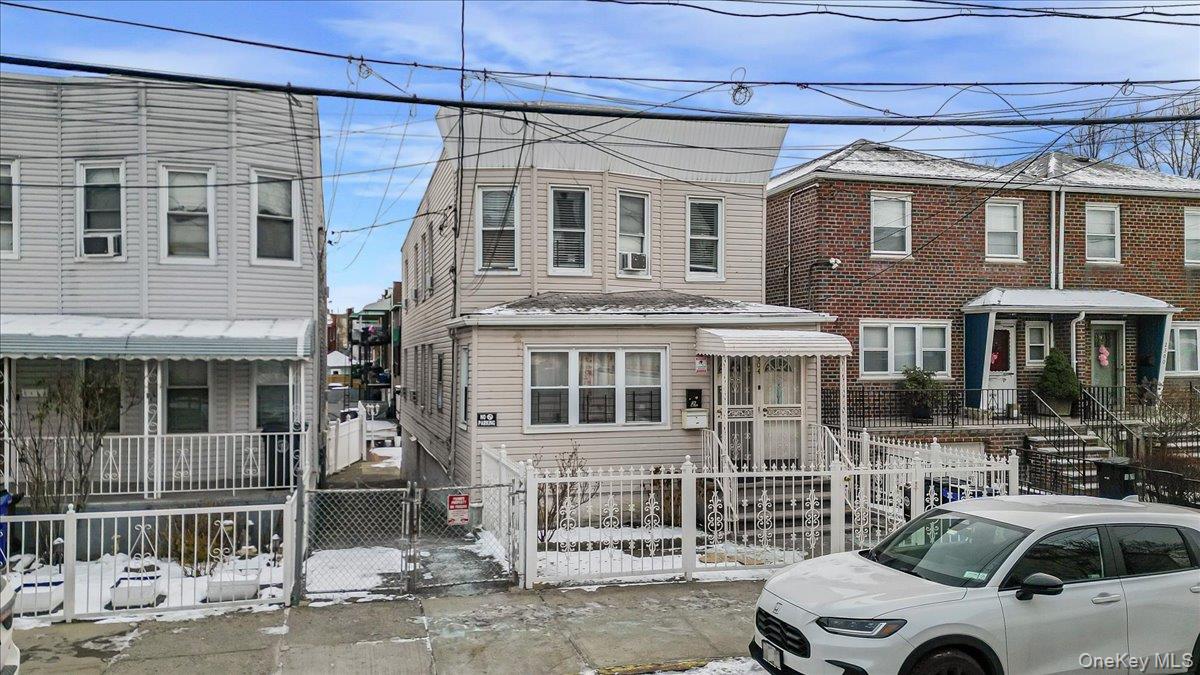 2304 Glebe Avenue Bronx, NY 10462 - Photo 36 of 36 a front view of a house with parking space
