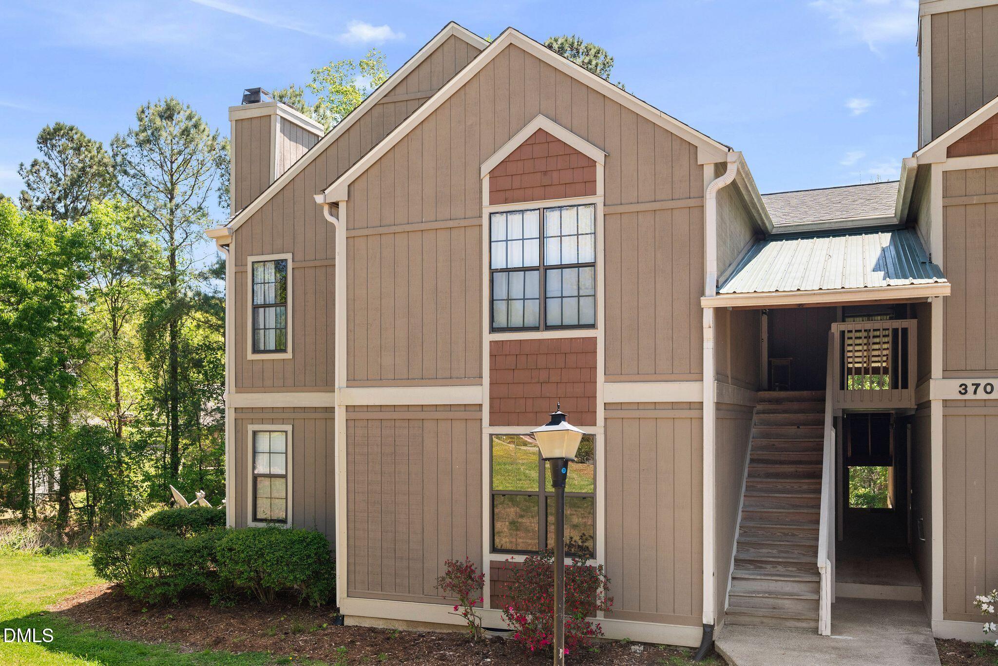 3704 Chimney Ridge Place, Unit 207 Durham, NC 27713 - Photo 30 of 31 a view of a brick house with many windows