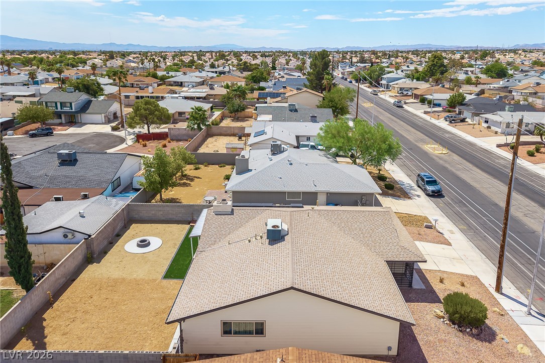 105 South Cimarron Road Las Vegas, NV 89145 - Photo 26 of 28 Aerial perspective reveals the home nestled within a quiet neighborhood surrounded by distant mountains.
