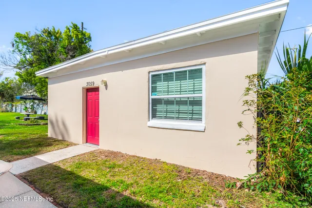 a front view of a house with a backyard