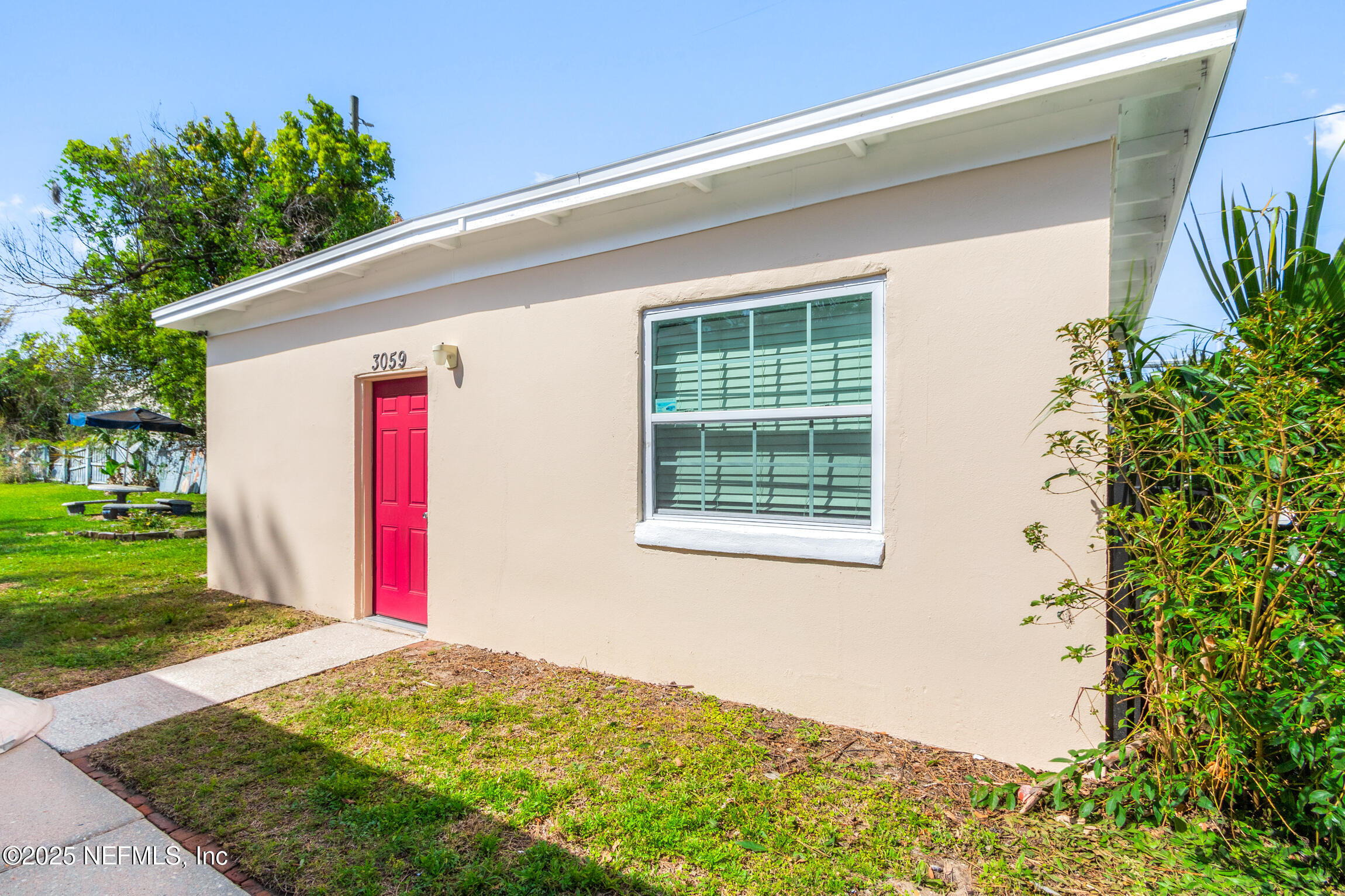 3039 Belden Street Jacksonville, FL 32207 - Photo 11 of 20 a front view of a house with a backyard
