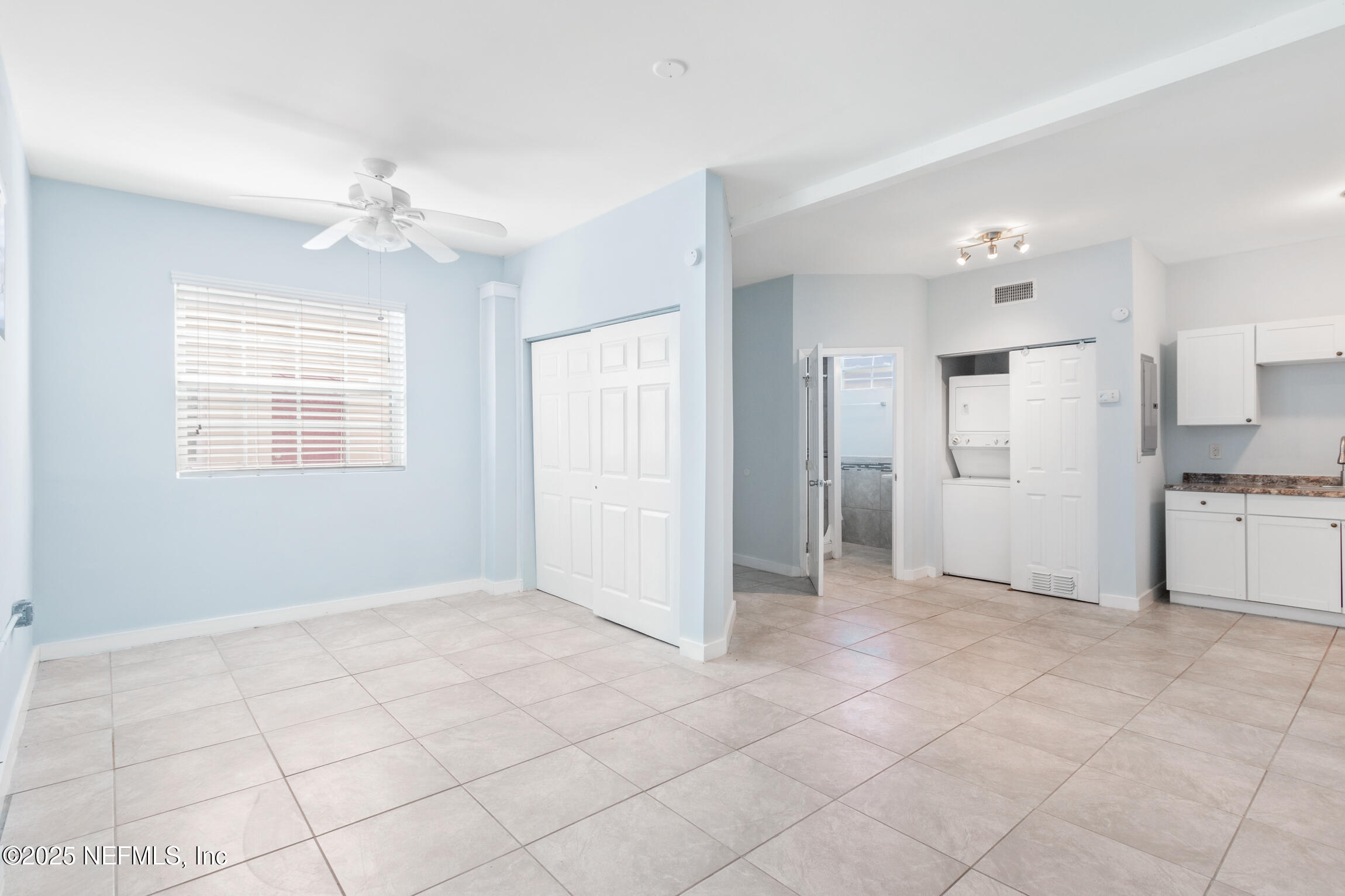 3039 Belden Street Jacksonville, FL 32207 - Photo 18 of 20 a view of a kitchen with an empty space and a window