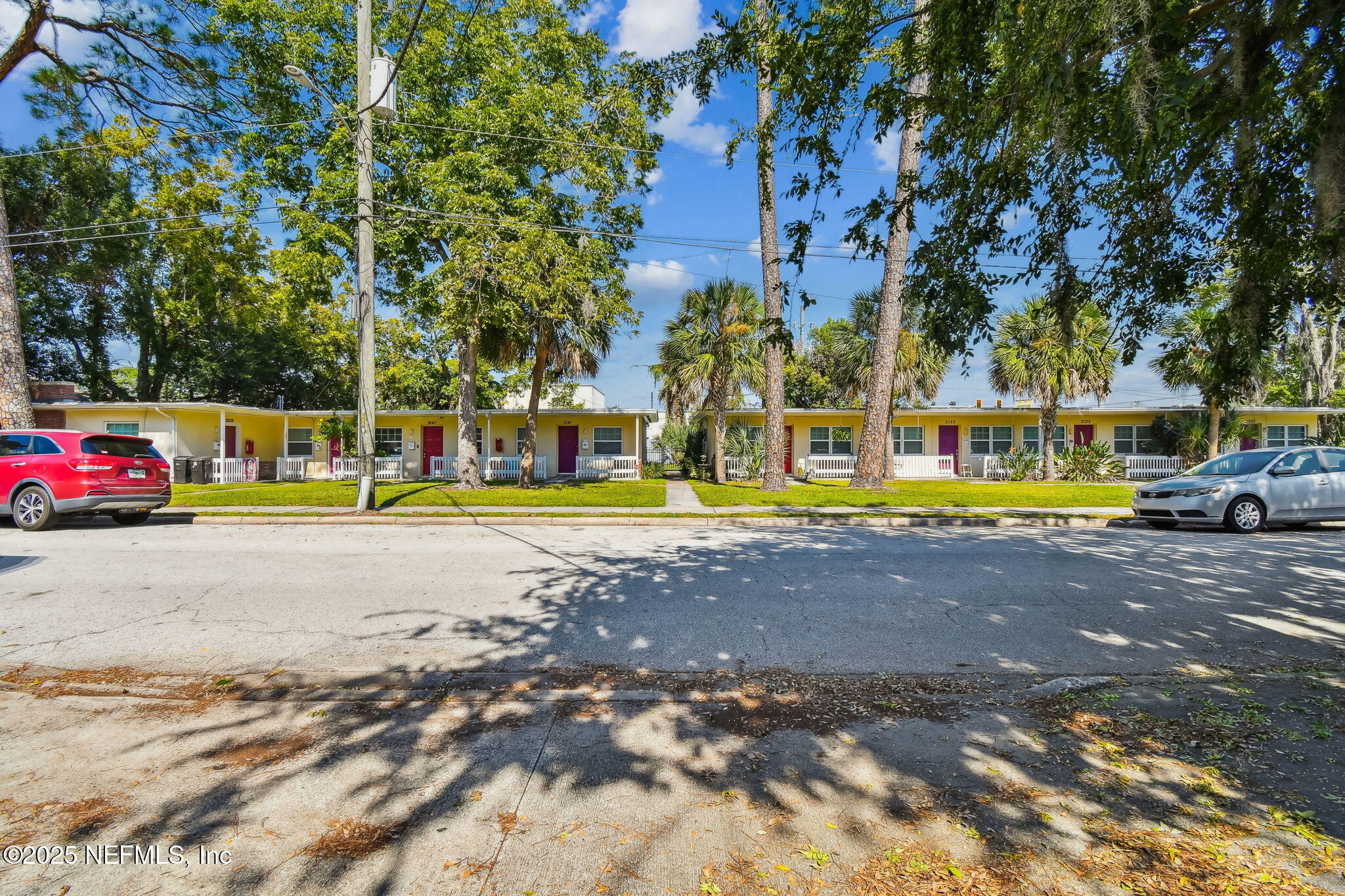 3039 Belden Street Jacksonville, FL 32207 - Photo 2 of 20 a view of yard with swimming pool and red chairs