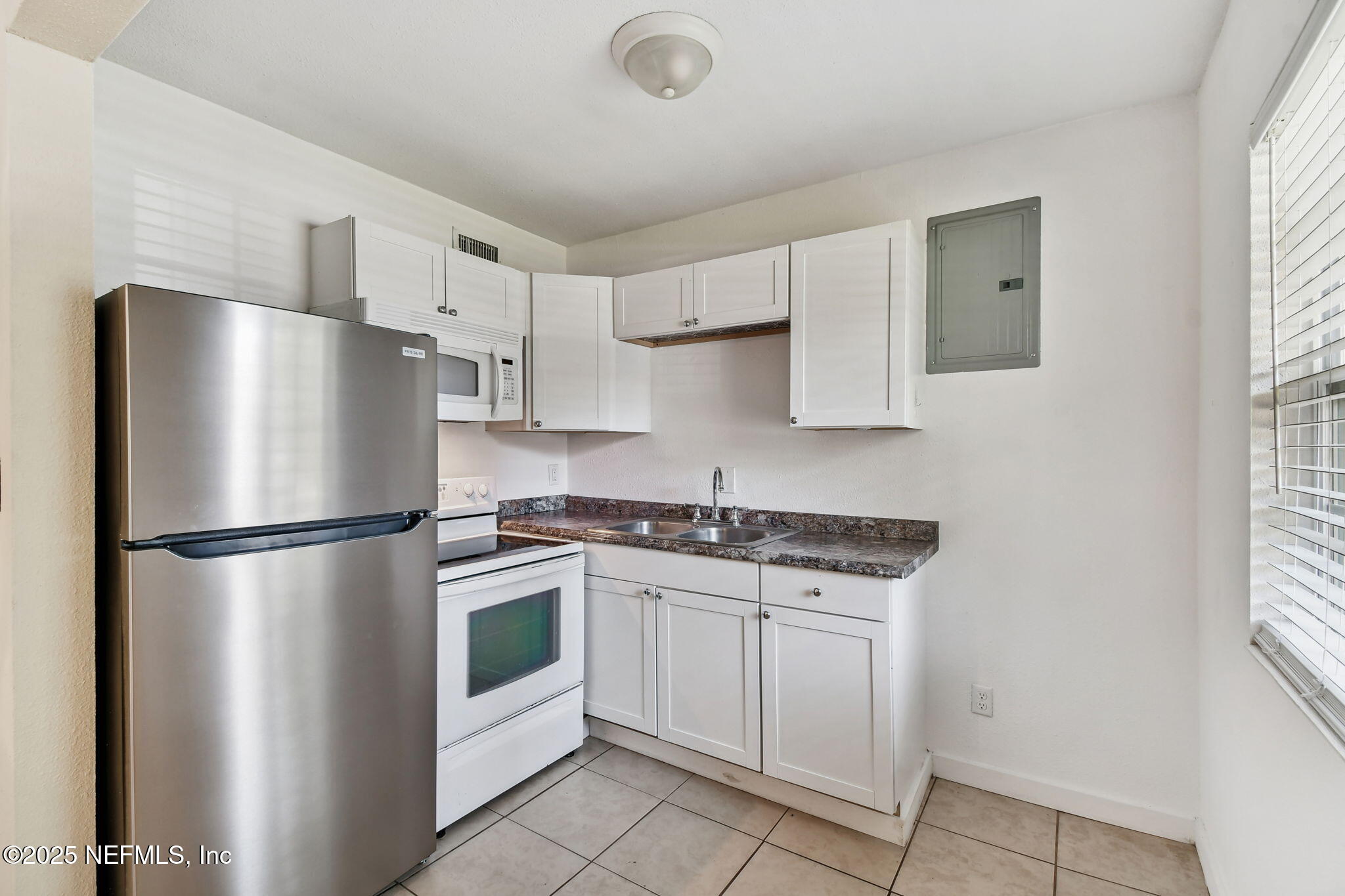 3039 Belden Street Jacksonville, FL 32207 - Photo 7 of 20 a white refrigerator freezer sitting in a kitchen