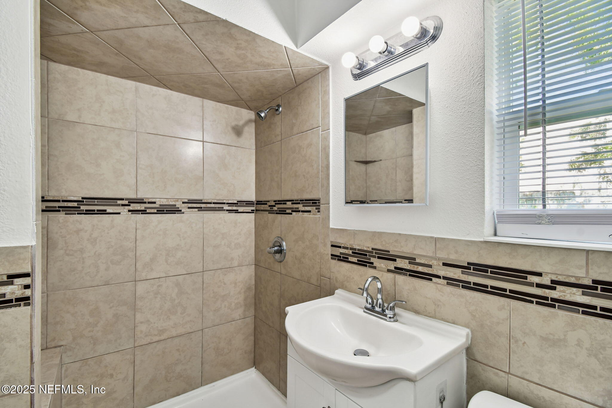 3039 Belden Street Jacksonville, FL 32207 - Photo 10 of 20 a bathroom with a sink and a mirror