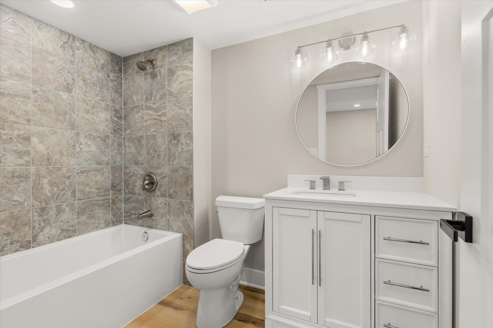 110 Kevin Drive Diamond, IL 60416 - Photo 30 of 39 a bathroom with a toilet a sink a mirror a bathtub and vanity