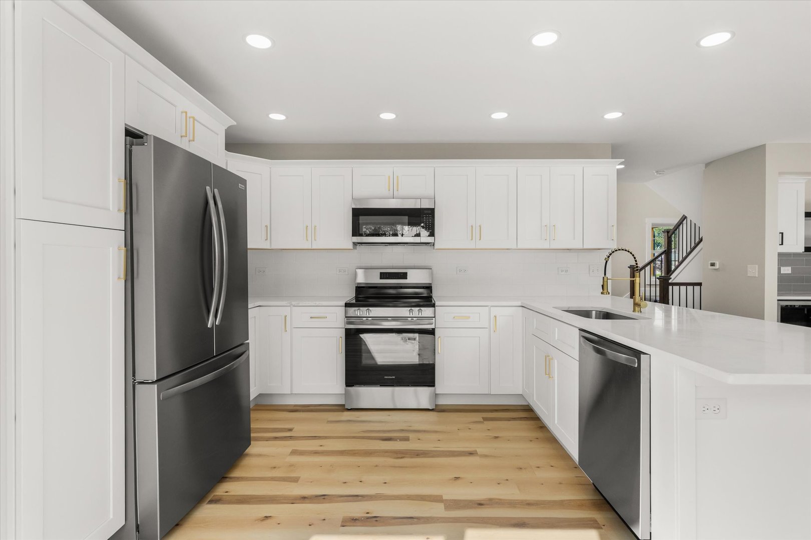 110 Kevin Drive Diamond, IL 60416 - Photo 3 of 39 a kitchen with a sink stainless steel appliances and cabinets