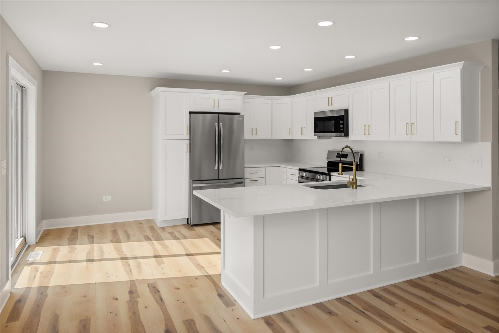 110 Kevin Drive Diamond, IL 60416 - Photo 5 of 39 a kitchen with stainless steel appliances a sink a stove a refrigerator and cabinets