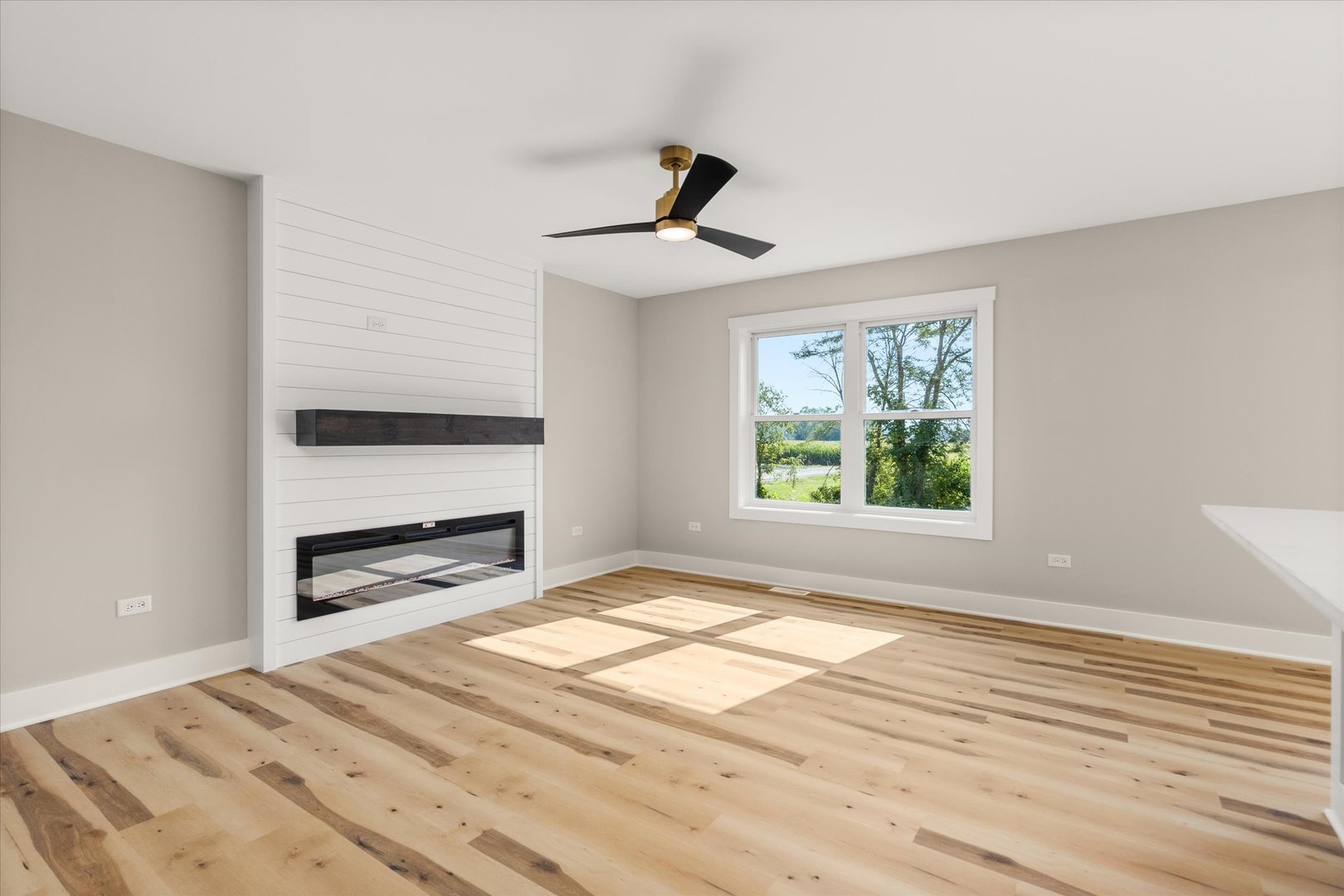 110 Kevin Drive Diamond, IL 60416 - Photo 8 of 39 a view of empty room with wooden floor and fan