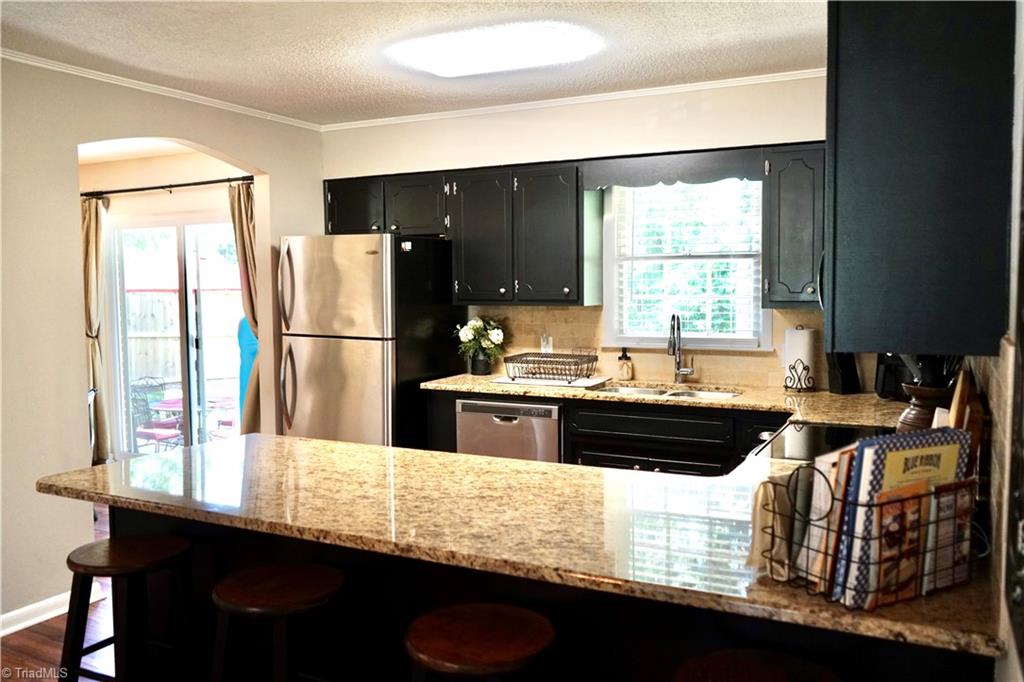 5816 Appling Road High Point, NC 27263 - Photo 12 of 39 Kitchen with granite countertops and stainless steel appliances