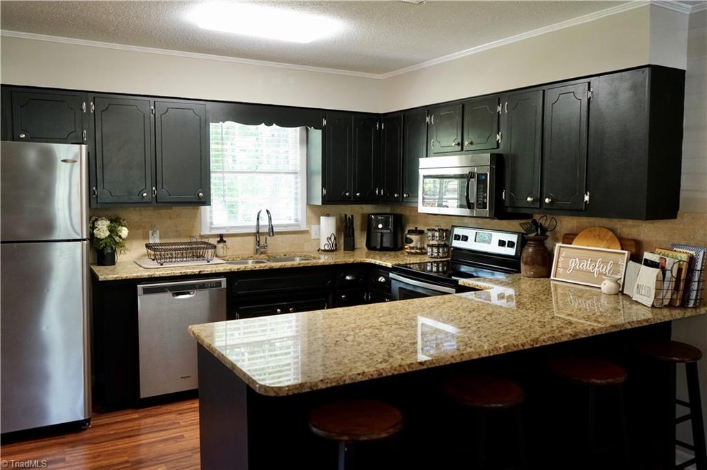 5816 Appling Road High Point, NC 27263 - Photo 13 of 39 Kitchen with black cabinets