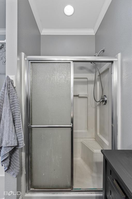 10606 Ferry Lake Road Oil City, LA 71061 - Photo 33 of 38 a bathroom with a glass shower door
