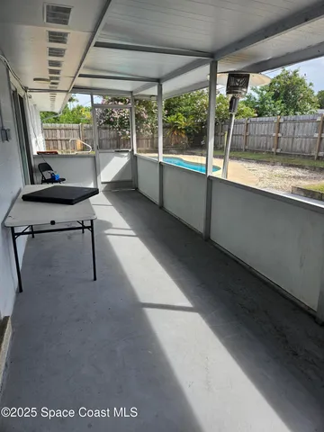 a room with furniture and a large window