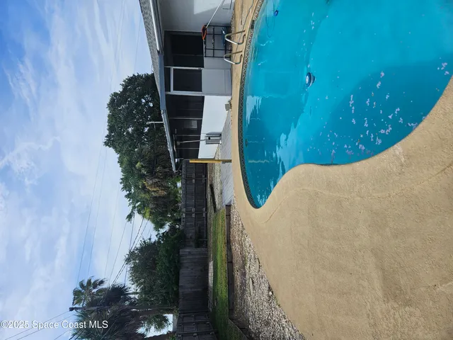 a view of a backyard with a patio