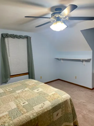 a kitchen with granite countertop a refrigerator stove and sink