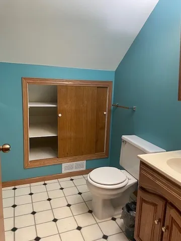 a bathroom with a sink and mirror