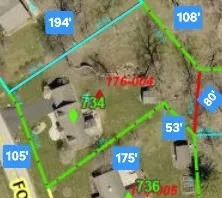 walk in closet with wooden floor