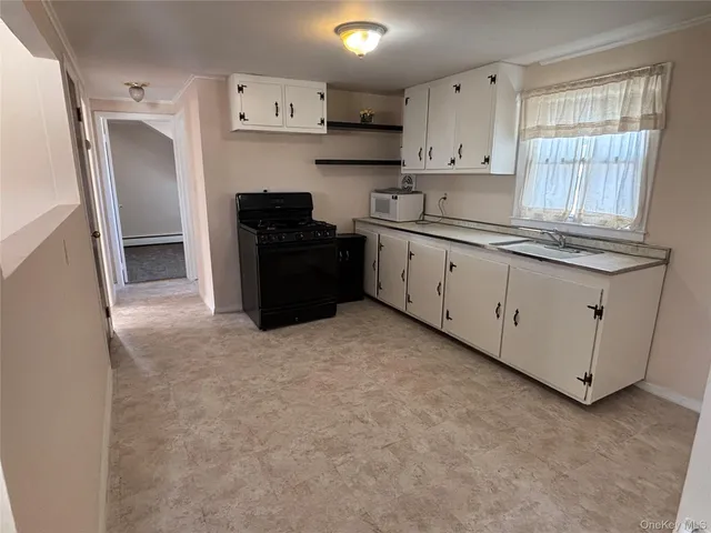 a kitchen with stainless steel appliances granite countertop a refrigerator and a stove