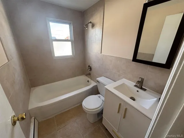a bathroom with a sink a toilet and a bathtub