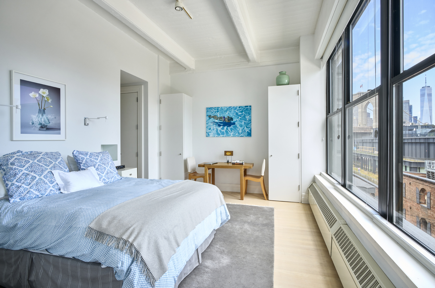 30 Main Street, Unit 7H Brooklyn, NY 11201 - Photo 4 of 10 a spacious bedroom with a large bed and a large window