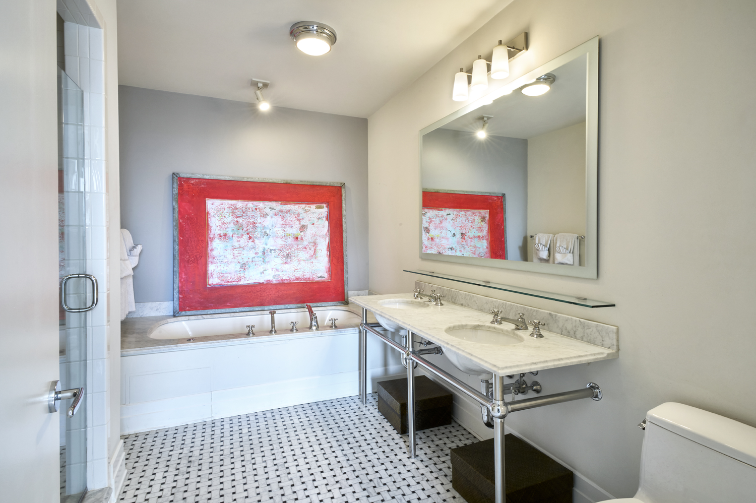 30 Main Street, Unit 7H Brooklyn, NY 11201 - Photo 5 of 10 a bathroom with a sink a mirror and a toilet
