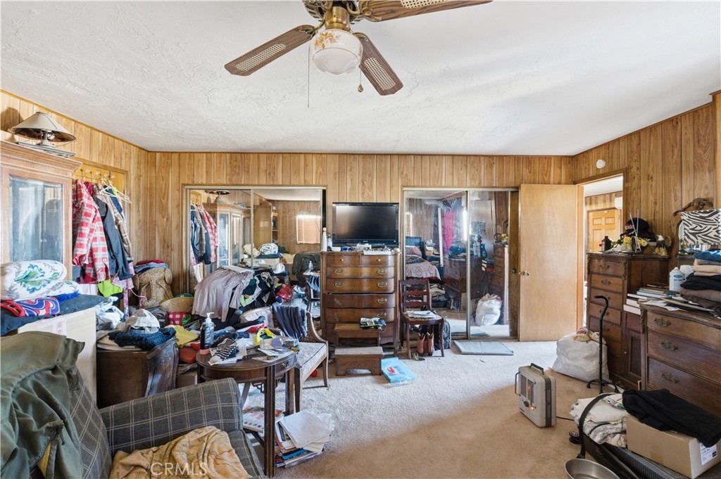 32787 Jagadon Road Lucerne Valley, CA 92356 - Photo 13 of 32 a living room with furniture and a flat screen tv