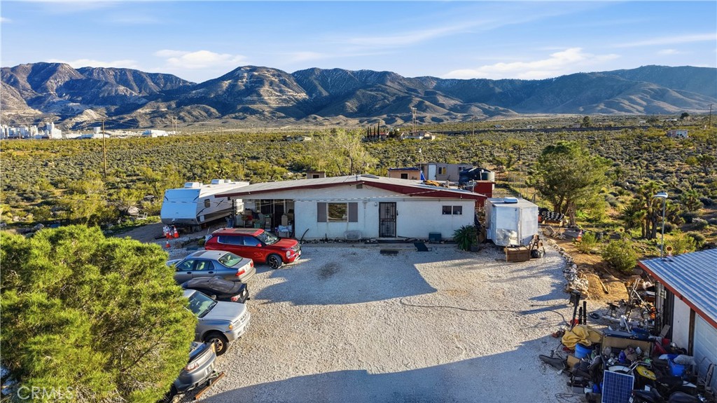 32787 Jagadon Road Lucerne Valley, CA 92356 - Photo 3 of 32 a view of house with outdoor space and seating area
