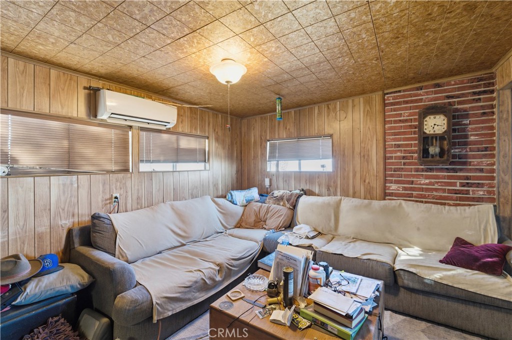 32787 Jagadon Road Lucerne Valley, CA 92356 - Photo 5 of 32 a living room with furniture and a large window