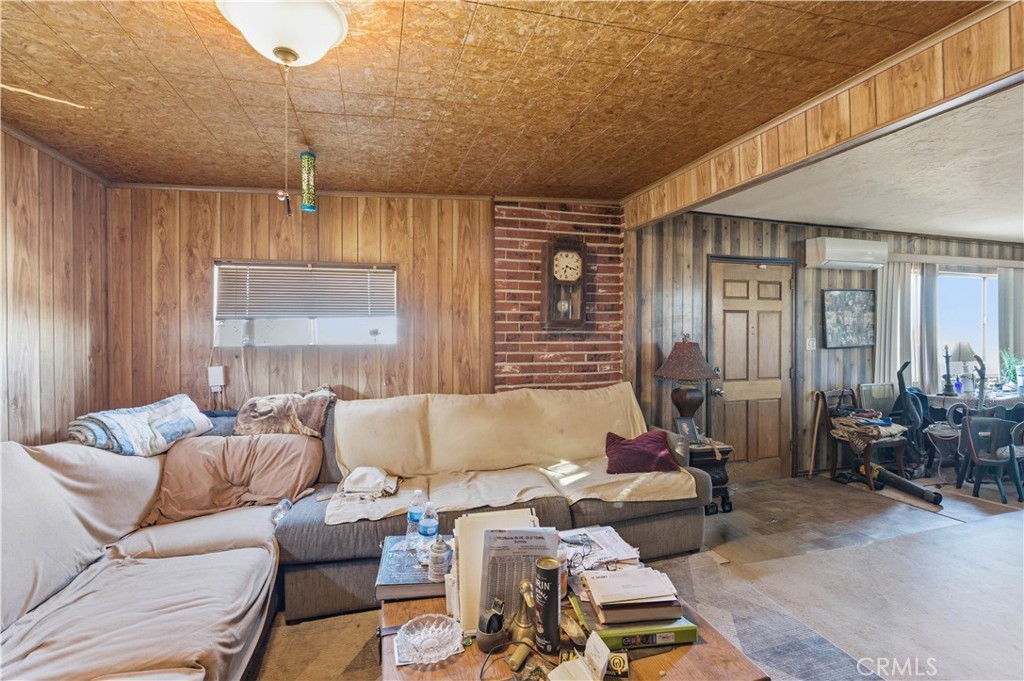 32787 Jagadon Road Lucerne Valley, CA 92356 - Photo 6 of 32 a living room with furniture and a window