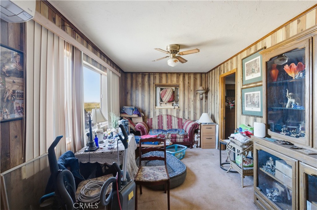 32787 Jagadon Road Lucerne Valley, CA 92356 - Photo 7 of 32 a living room with furniture and a large window