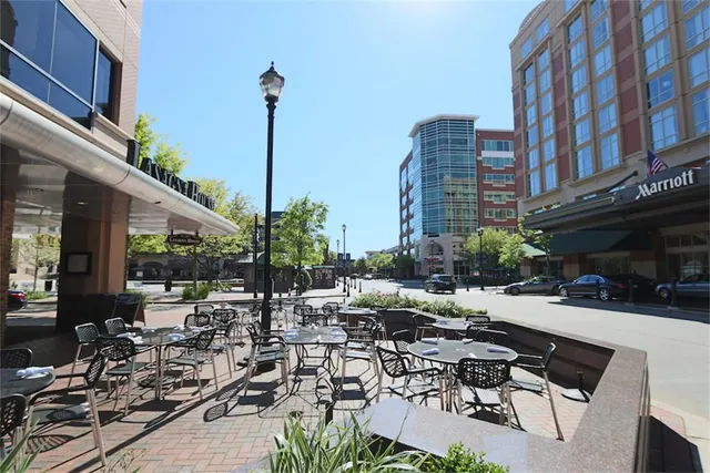 a view of a house with cars park