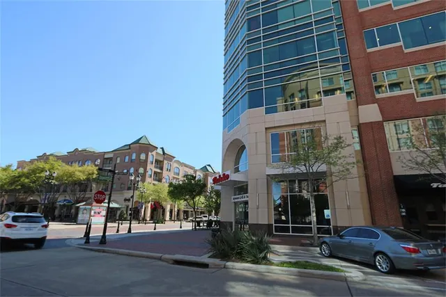 a front view of a building with a yard
