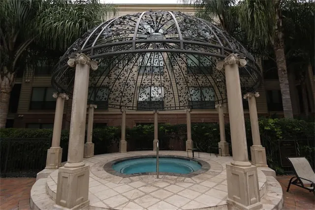 a living room with wooden floor and furniture