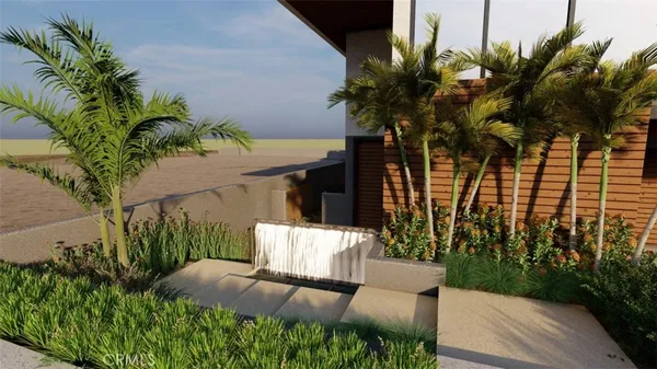 a view of a yard with plants and a bench
