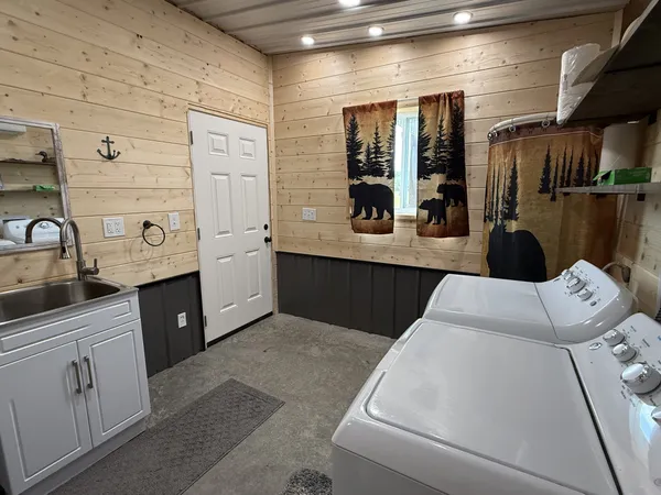 a kitchen with granite countertop a stove and cabinets