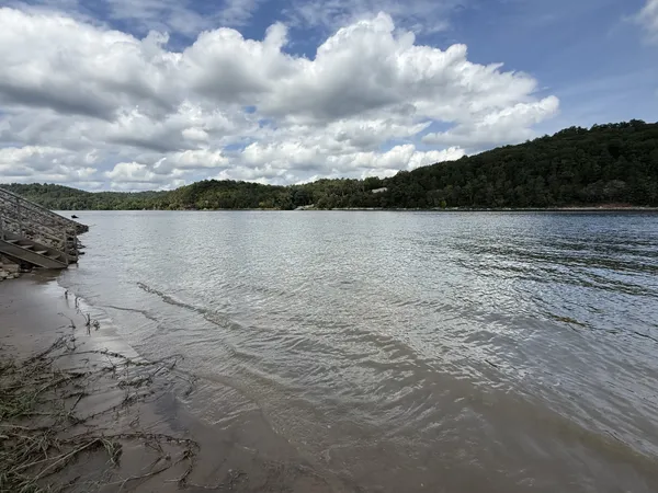 a bedroom with a bed and a flat tv screen