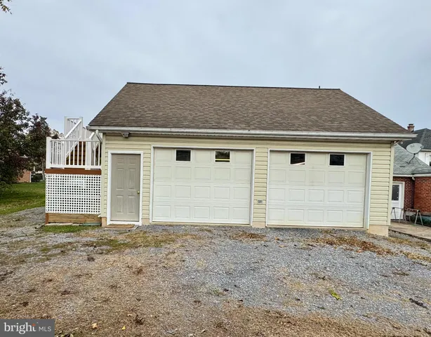 a view of a house with wooden deck
