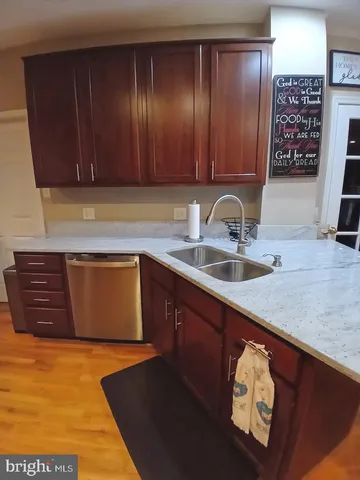 a kitchen with stainless steel appliances granite countertop a sink stove and microwave