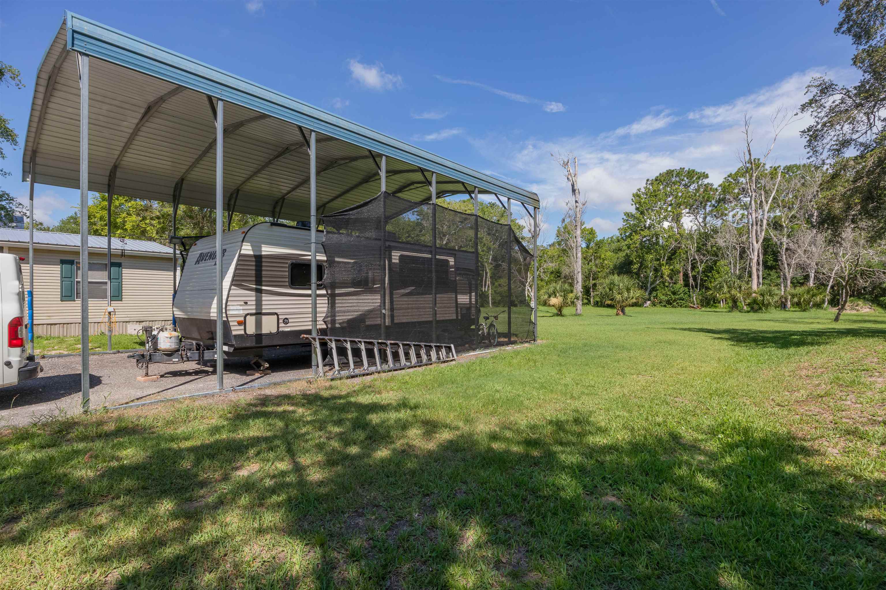 540 Stokes Landing Road St. Augustine, FL 32095 - Photo 42 of 77 a view of a house with a yard