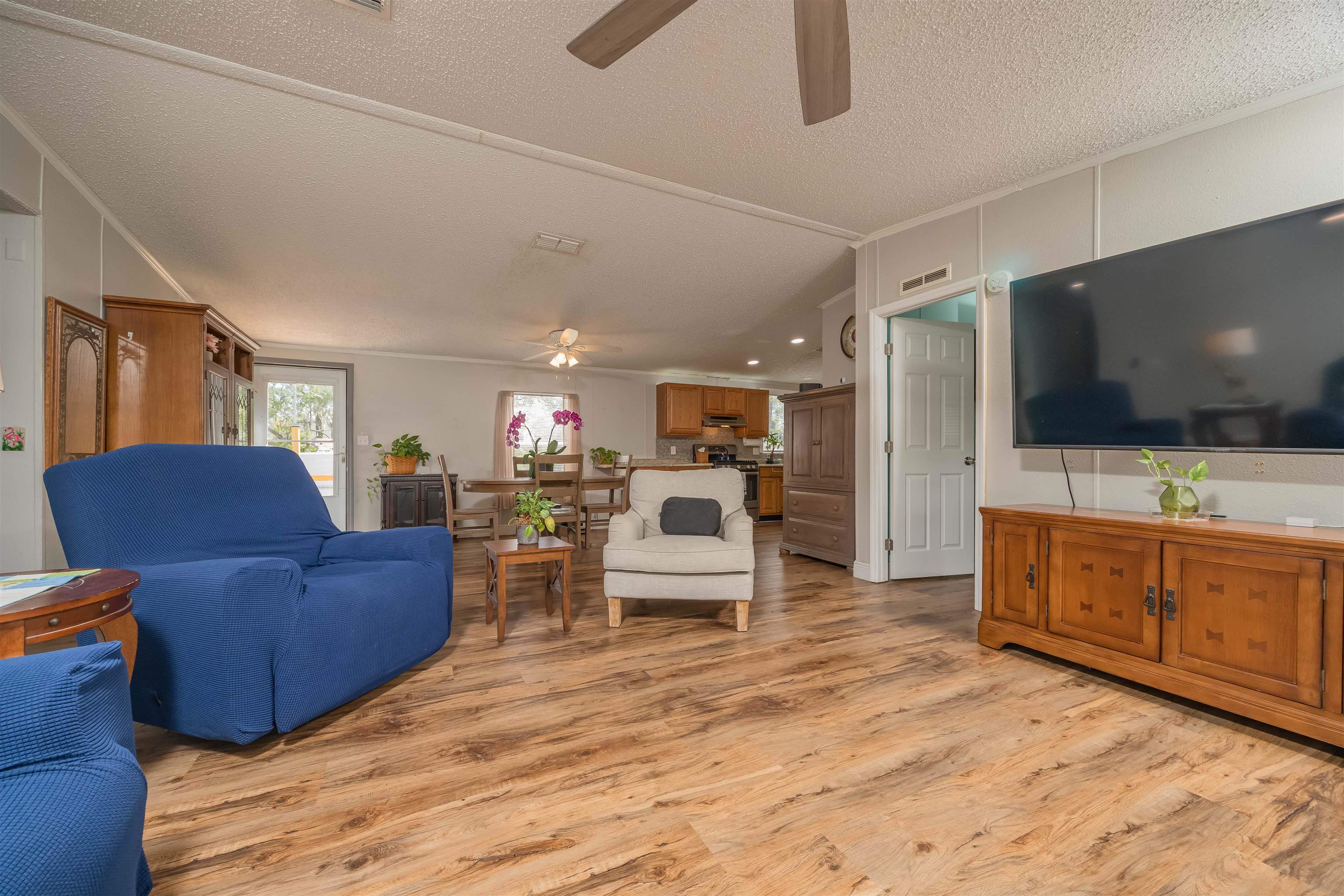 540 Stokes Landing Road St. Augustine, FL 32095 - Photo 8 of 77 a living room with furniture and a flat screen tv