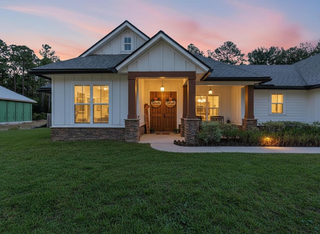 75774 Edwards Road Yulee, FL 32097 - Photo 1 of 70 a front view of a house with a yard and garage