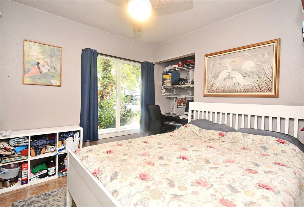 31 Chip Court Kissimmee, FL 34759 - Photo 15 of 37 a large bed sitting in a bedroom next to a window