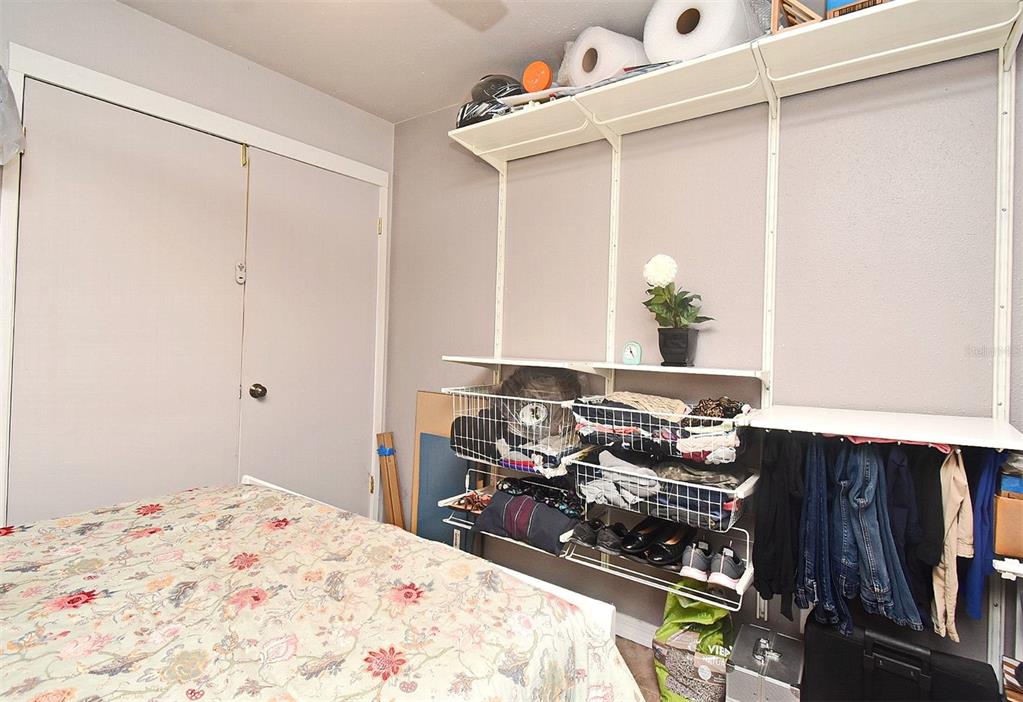 31 Chip Court Kissimmee, FL 34759 - Photo 16 of 37 a bedroom with a bed and a dresser in it