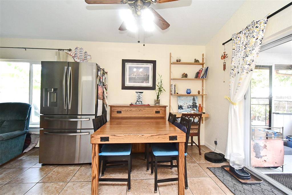 31 Chip Court Kissimmee, FL 34759 - Photo 29 of 37 a kitchen with stainless steel appliances granite countertop a refrigerator and a stove top oven