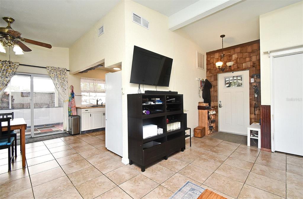 31 Chip Court Kissimmee, FL 34759 - Photo 33 of 37 a living room with furniture and a flat screen tv
